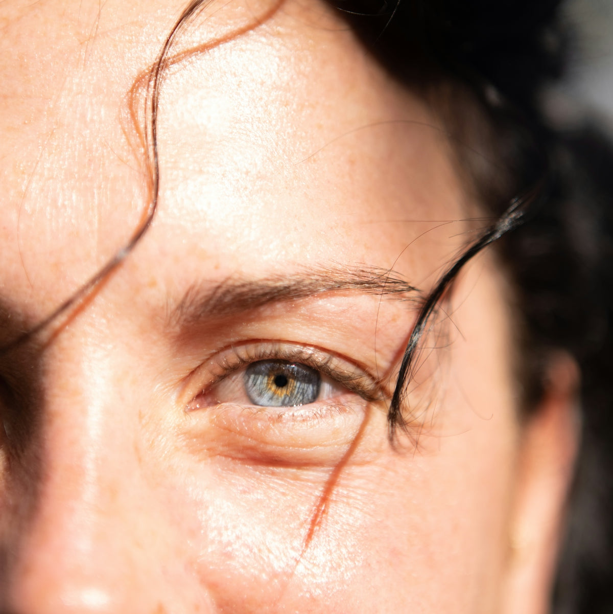 a close up of a person's blue eyes